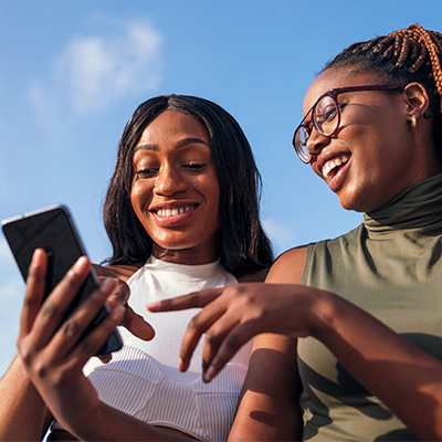 Two women looking at mobile