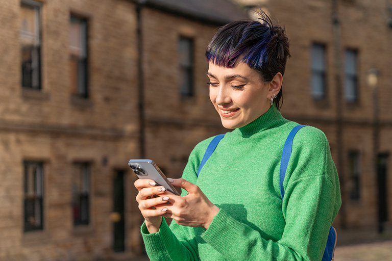 Woman using phone outside