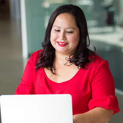 federal staff member working on laptop