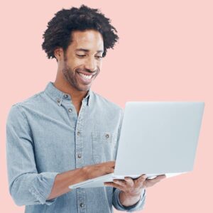 Man enjoying his day while filling out a permit application on his laptop