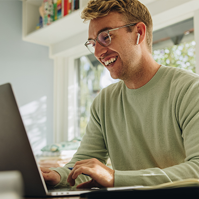 Smiling man in online meeting