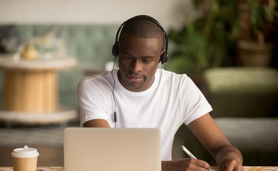 man watching video on laptop