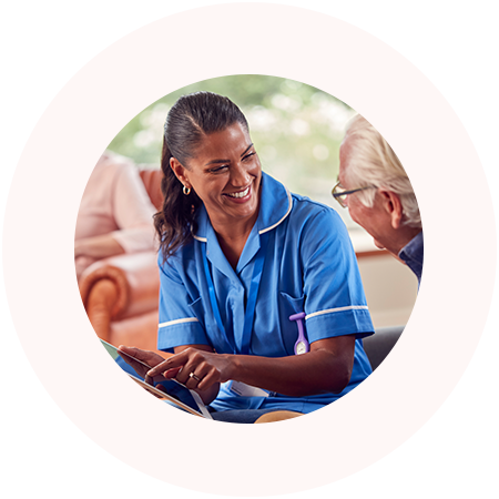 Nurse talking with elderly patient